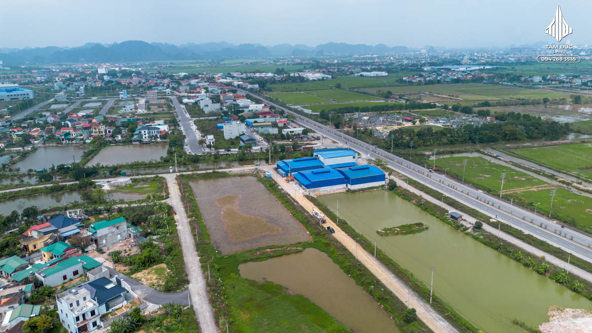 Aerial view of rural landscape and buildings.